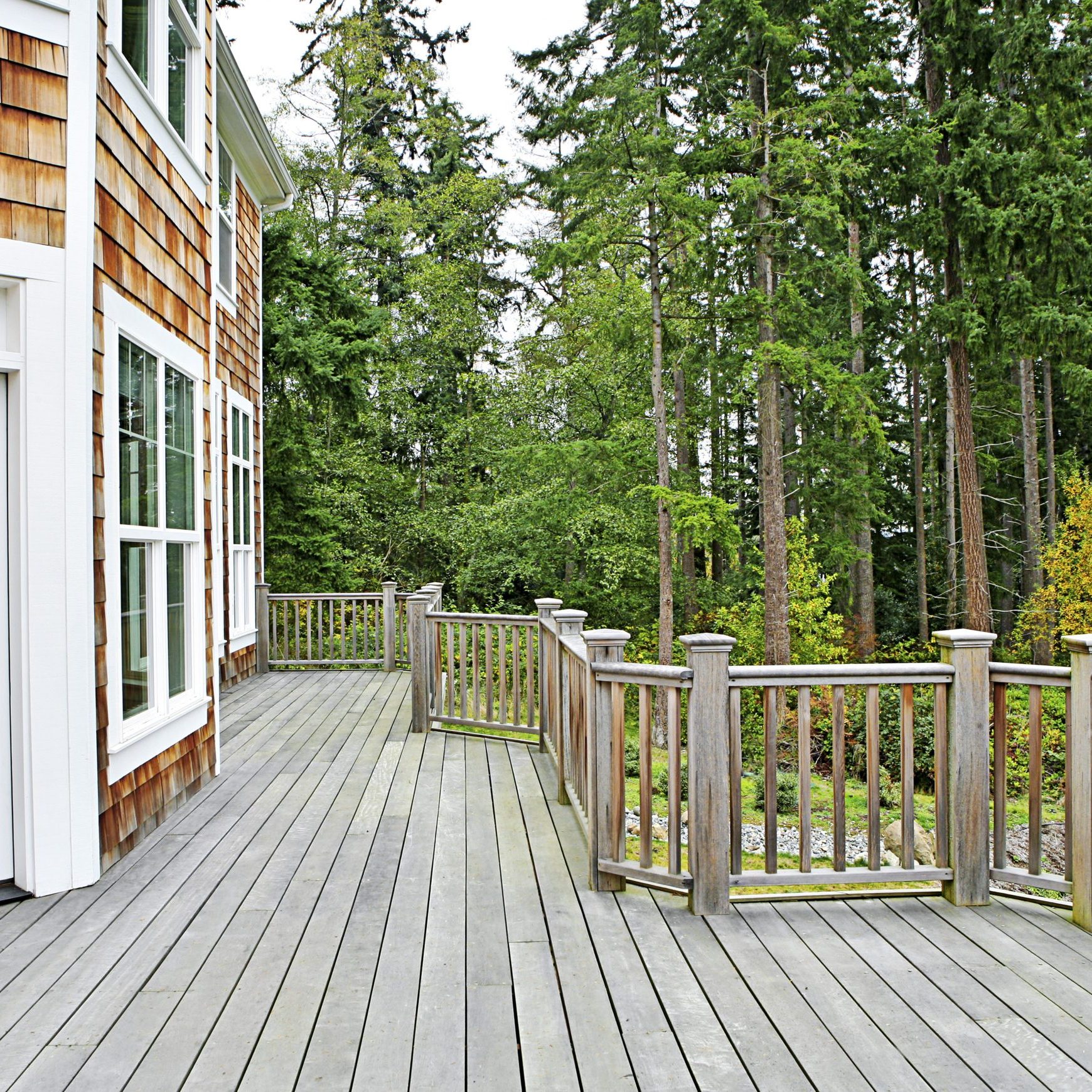 Wooden deck on house near forest